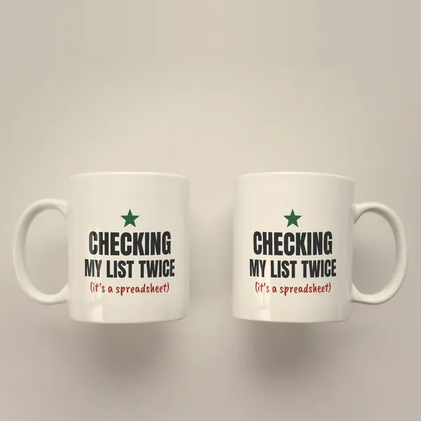 Two white 11 oz ceramic mugs printed with "Checking My List Twice (It's a Spreadsheet)", handles left and right
