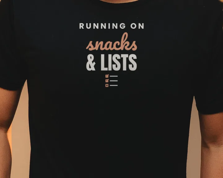 Man wearing a black "Running on Snacks and Lists" tee against a warm backdrop (light-ink print for dark shirts)